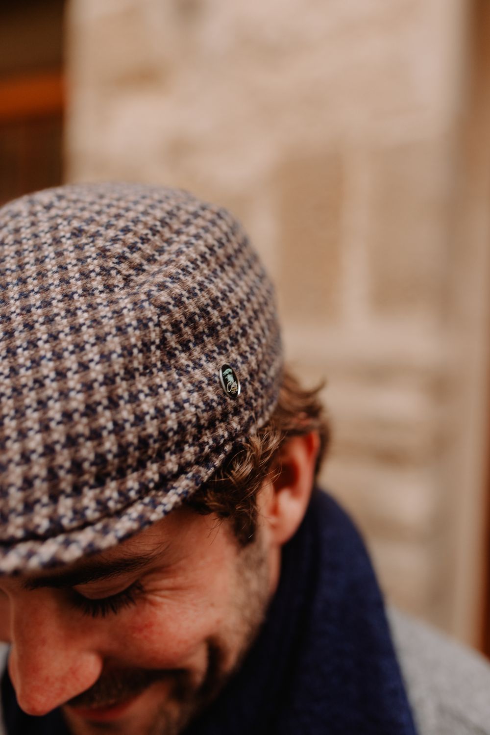 Dark blue flat cap.
